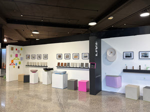 Modern interior design showroom with various decor items and furniture.