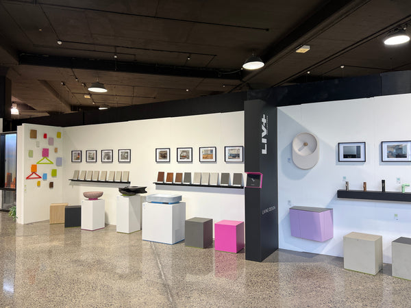 Modern interior design showroom with various decor items and furniture.